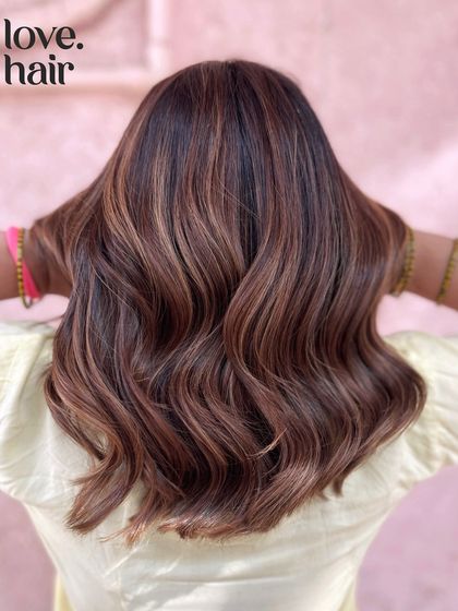 A back view of our 'Vietnamese brew' balayage, showing the rich, dark brown base and the subtly lighter highlights that add dimension.
