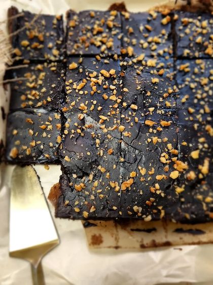 A freshly baked tray of our classic fudgy brownies, topped with chopped nuts. They are perfect as a standalone treat or as an add on to any gift hamper.