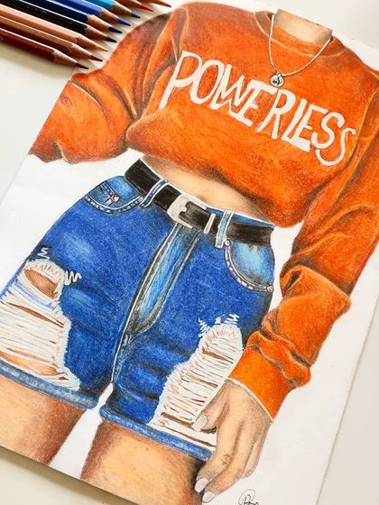An angled view of the finished outfit illustration, with the colored pencils I used displayed.