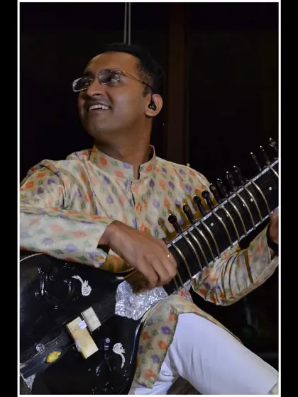 A moment of joy while playing for a small, appreciative audience. The connection in a 'Baithak' is truly special.