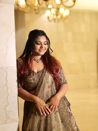 A candid moment captured. Her natural glow is enhanced by a subtle makeup application, proving that sometimes less is more.