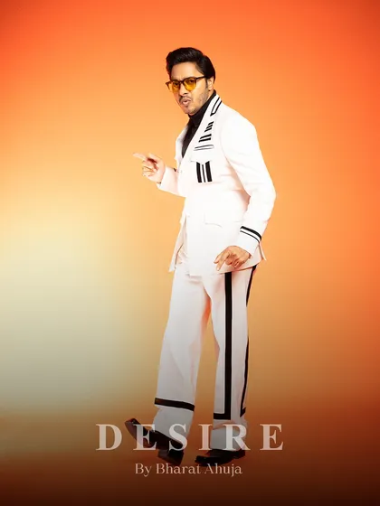 A fun, expressive pose in the white and black striped suit. This is fashion that lets your personality shine.