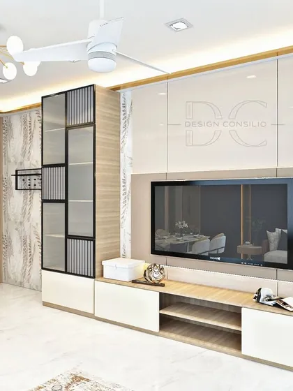 This TV unit design features a mix of materials, including wood, high-gloss laminate, and glass. The asymmetrical design of the display shelves adds a unique, modern touch to the living room.