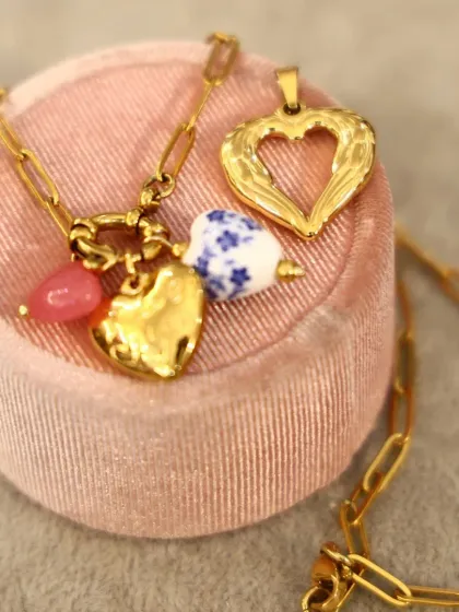 For the one who loves unique pieces, this Valentine's gift set features our charming heart-themed necklaces. Notice the mix of textures, from hammered gold to delicate blue and white porcelain-style charms.