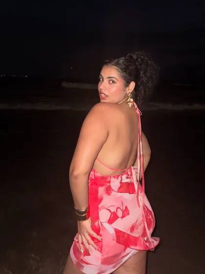 Another look at the back of this gorgeous halter dress. The open back is perfect for a warm vacation evening.