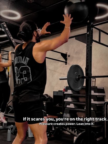 Pressure creates power. A client performs wall balls, a classic CrossFit and Hyrox movement that builds explosive power in the legs and shoulders.