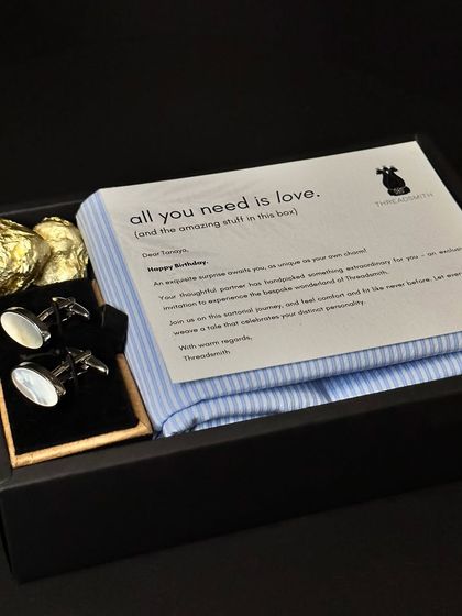 Unleash the magic of gifting with a touch of thoughtful luxury. This gift set, including a custom shirt fabric and cufflinks, weaves a story of sophistication and delight.