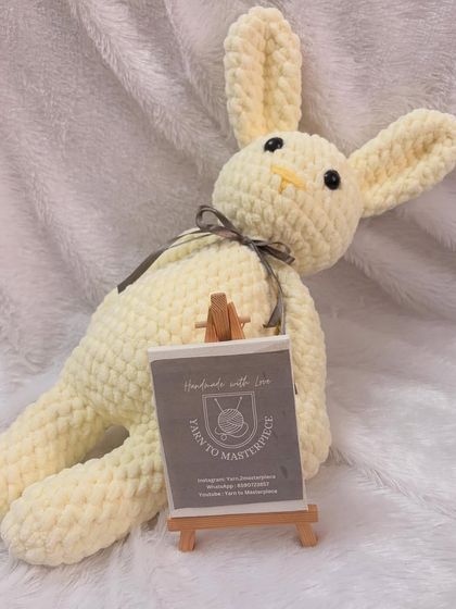 A large, floppy bunny made from plush yarn, perfect for snuggling. I can make these in any color you choose.
