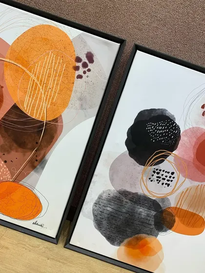 A pair of abstract artworks in matching floater frames, ready to be hung as a diptych. The consistent framing creates a professional and intentional look.