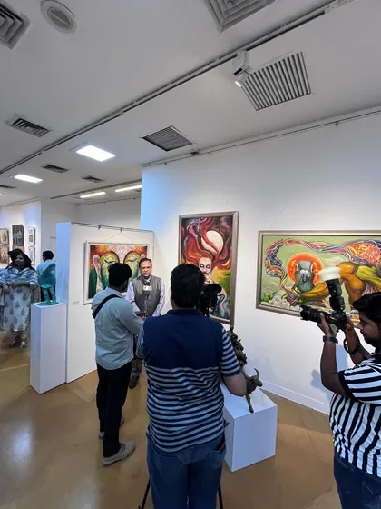 Media interviews are an important part of sharing the story behind the art. Here, I am being interviewed at the gallery, discussing the concepts and inspiration for my paintings and sculptures.