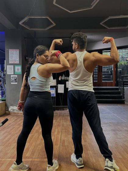 We don't just chase goals, we crush them together. Flexing with my favorite workout partner.