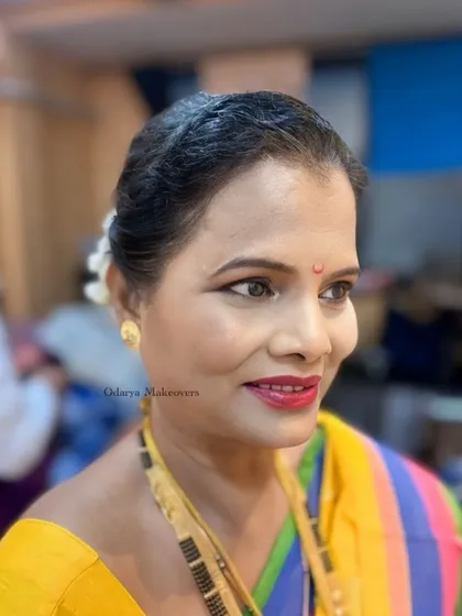 Another shot of this beautiful, confident lady. The makeup is soft and natural, enhancing her lovely smile.
