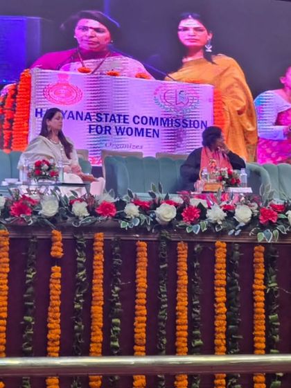 The stage at the Haryana State Commission for Women event, a platform for crucial conversations on women's safety.