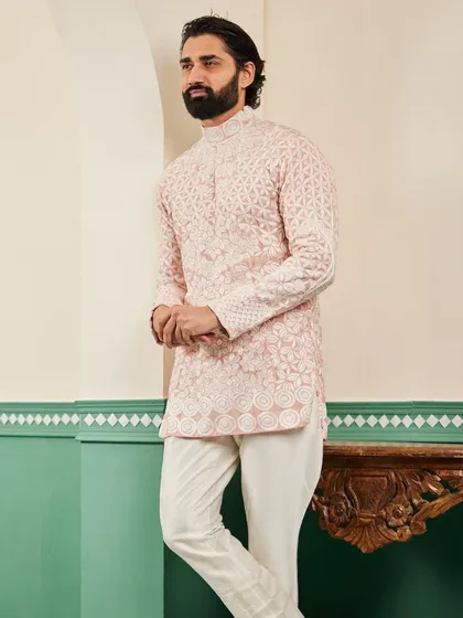 A full-length view of the blush pink geometric kurta, a modern and sophisticated choice for a festive event.