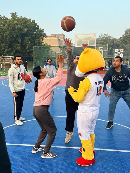 Our mascot Benny joins the tip-off for the Parents' Fun Match. We believe in making sports a joyful experience for the entire family.