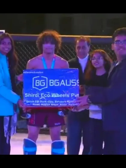 Another one of our champions receiving his prize money at Elite Combat MMA, showing that dedication to the sport brings tangible rewards.