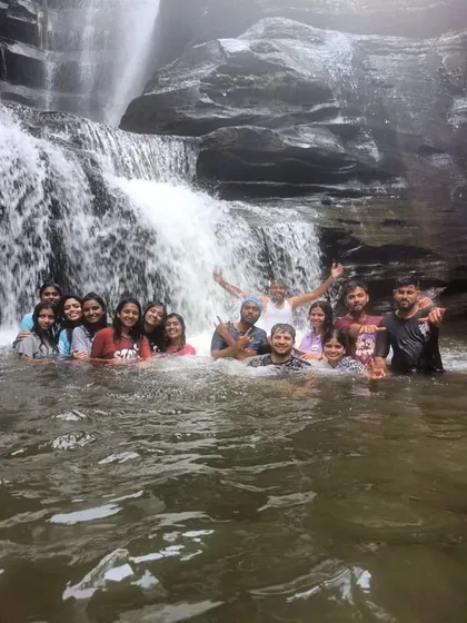 Our group enjoying a swim in a waterfall during a long weekend monsoon trip.