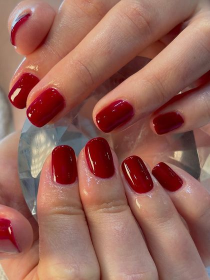Wine not? A deep, glossy wine-red manicure is the epitome of classic elegance. This is a gel polish on short, natural nails, shaped perfectly.