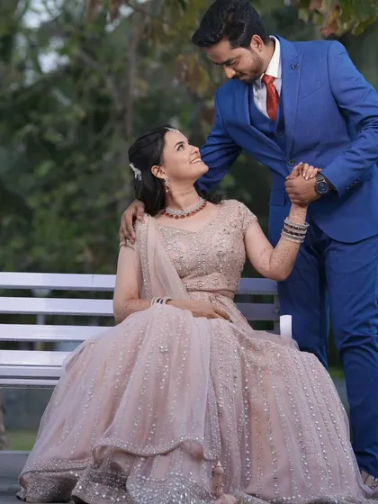 A romantic photo of a couple on their reception day. The bride's makeup is soft and glowing, perfect for this sweet moment.