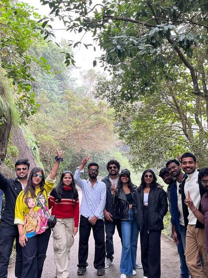 The group posing on a scenic road during our exploration of Kodaikanal's surroundings.