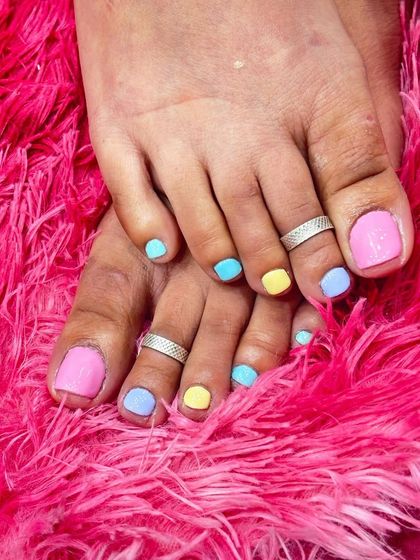 Add a pop of color to your toes! This fun pedicure features a mix of bright pastel gel polishes, perfect for summer or anytime you want to brighten your day.