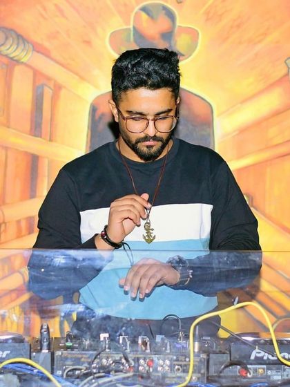 A moment of focus. Adjusting the levels to create the perfect sound.