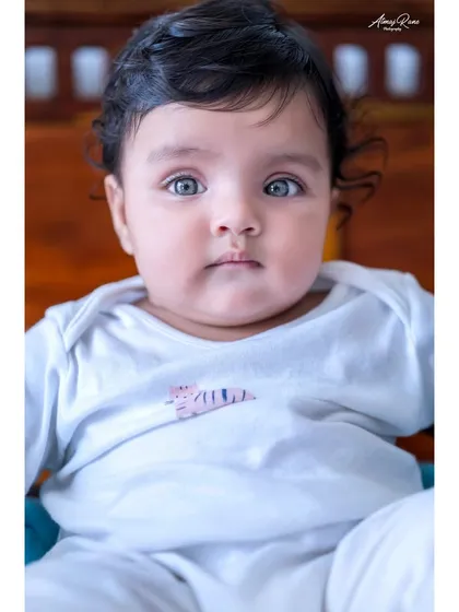 Sometimes, a simple portrait says it all. The beautiful, curious eyes of six-month-old Anika are the focus of this shot. I use professional equipment to capture these stunning, clear close-ups that you will treasure forever.