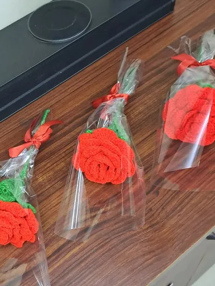 Three of my single crochet roses, individually wrapped and ready to go. These are perfect for bulk orders for events or as simple thank you gifts.