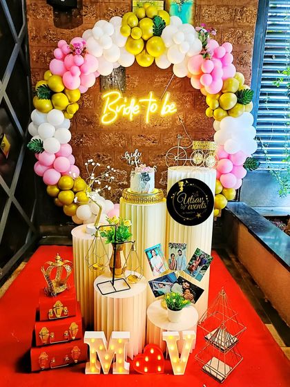 Another view of the 'Bride to be' setup, showing the elegant arrangement of props like a miniature bicycle, a crown, and marquee letters.