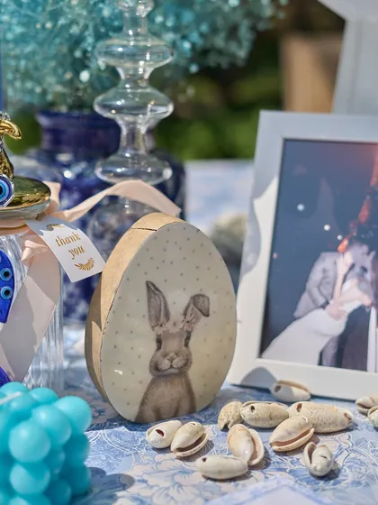 A whimsical, egg-shaped box with a bunny illustration, part of the curated decor that made the event feel personal and unique.