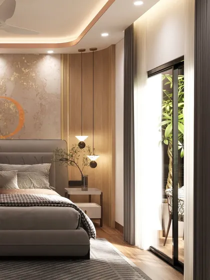 A close-up of the bed and side table, showing the warm wood tones, pendant lighting, and textured gold-leaf accent wall.