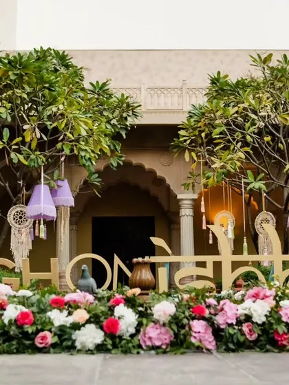 "High on Ishq" - a perfect tagline for a wedding celebration. We use custom signage to reflect the theme and personality of the couple throughout the venue.