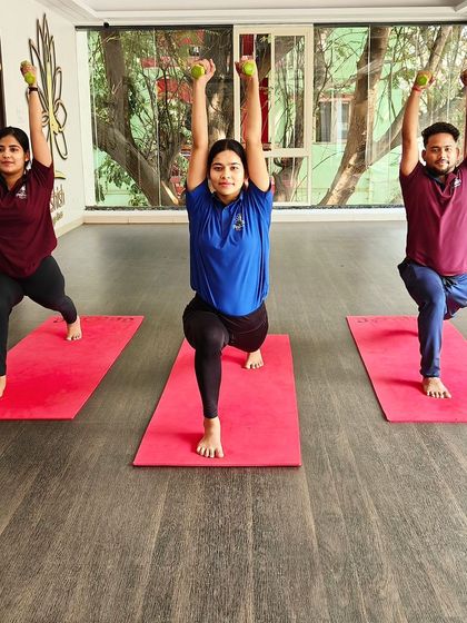 Holding a high lunge with weights overhead builds strength in the legs, core, and shoulders simultaneously.