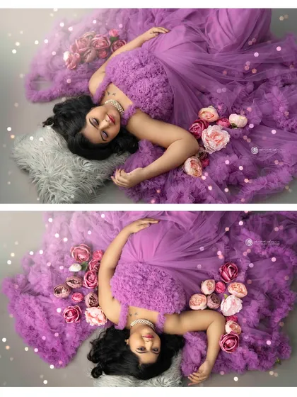 A creative top down shot, using the flowing purple gown and scattered flowers to create a dreamy, artistic composition that feels like a painting.