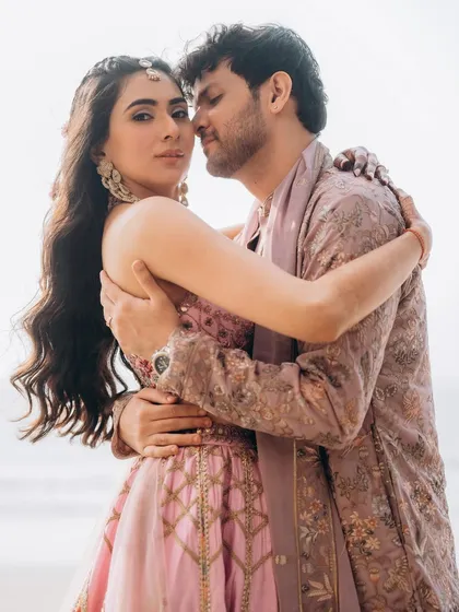 An embrace filled with affection. This candid shot of Rupanshi and Yash captures a natural, unposed moment of love.