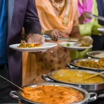 Guests enjoying our buffet at a private event. We love seeing people delight in the food we prepare, and our buffet service is designed to be seamless, allowing everyone to serve themselves with ease.