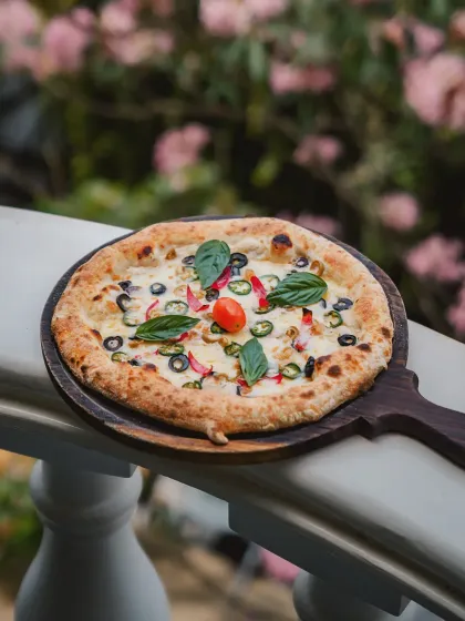 Our food is a story in itself. Imagine enjoying a freshly baked pizza, with the cool Bangalore breeze on one of my balconies. It's these simple, perfect moments that define the experience here.