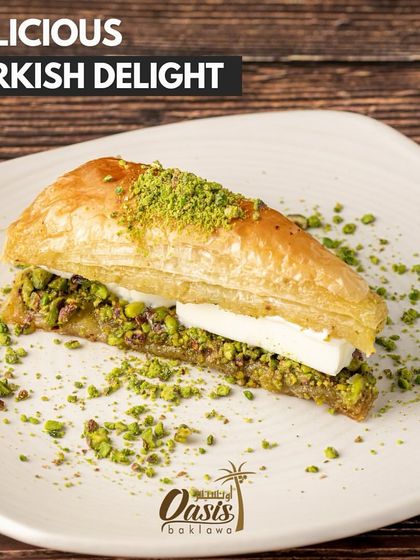 A slice of our delicious Turkish delight, a variation of baklava with a creamy filling sandwiched between layers of nutty pastry.