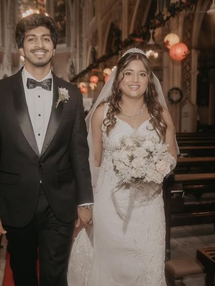 The newly married couple walking down the aisle of the church. This classic shot captures their first moments as husband and wife, filled with joy and hope.