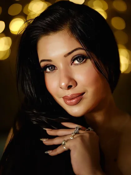 An elegant portrait with a beautiful bokeh background. This type of shot emphasizes a flawless makeup look and is ideal for magazine features and high-end beauty product advertisements.