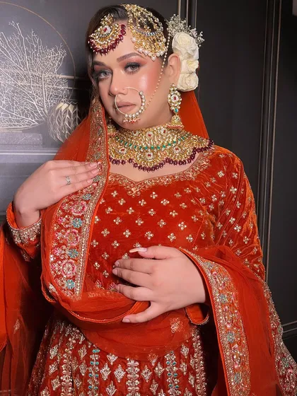 An extensive series from a bridal demo, showcasing a red velvet Anarkali-style lehenga. This is a valuable resource for MUAs learning to create a classic bridal look.