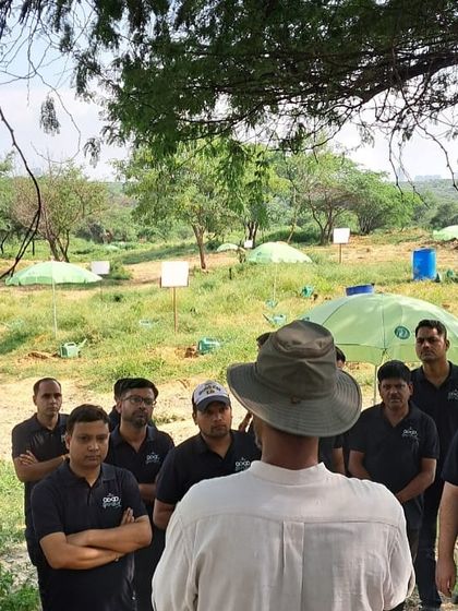 Our rewilding expert briefs the Bacardi team at Aravali Nagar Van before their planting drive, explaining the challenges the forest has faced and the importance of their contribution.