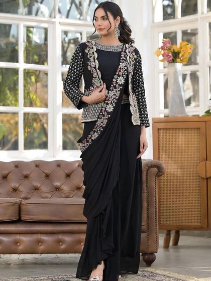 A full view of our black drape saree paired with a stunning embroidered jacket. This is a power outfit, perfect for a formal reception or a corporate event.