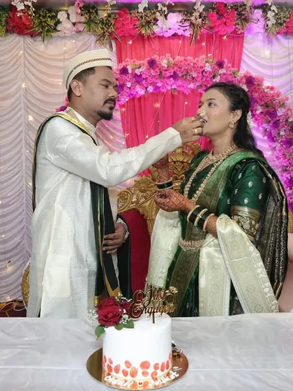 The moment of cake cutting is always special. This couple is sharing their first sweet bite during their engagement ceremony, a beautiful start to their journey together.