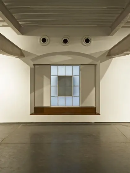 The design for Project 88 gallery involved stripping back a former printing press to its essential structure. The restored industrial columns and beams create a powerful dialogue with the contemporary art displayed within the space.
