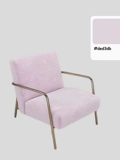 A studio shot of the Bliss Arm Chair, highlighting its soft lavender color and modern, minimalist frame.