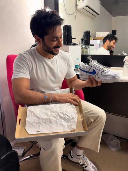 Another shot of Harsh Beniwal enjoying his personalized sneakers.