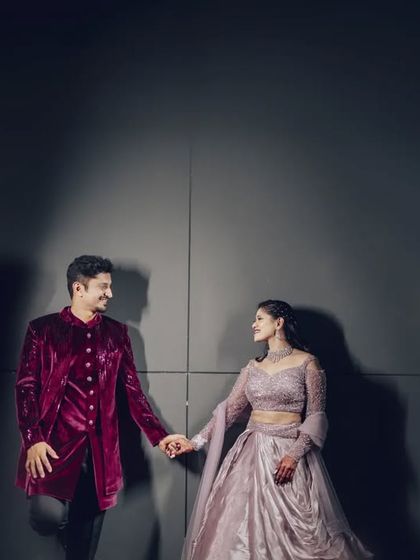 A modern and moody couple portrait using a simple background and dramatic shadows. This style is perfect for creating a sophisticated and timeless look.