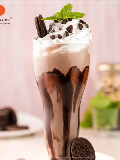 Dive into our Oreo Chocolate Shake, a fan favorite for a reason. We blend rich chocolate and real Oreo cookies into a thick, satisfying shake, then top it with whipped cream and more cookie crumbles. It's pure, chilled indulgence in a glass.
