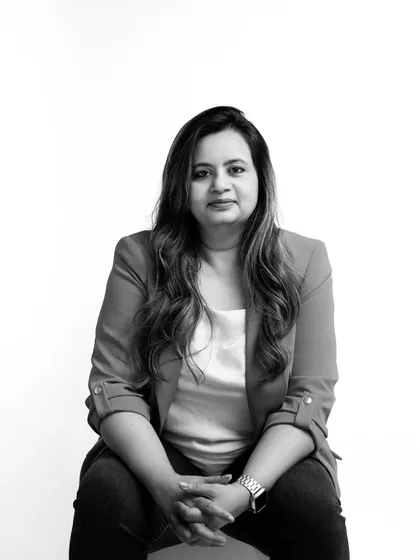 A black and white portrait offers a timeless and artistic feel. This image highlights her expression and removes all distractions, creating a strong and memorable professional photo.